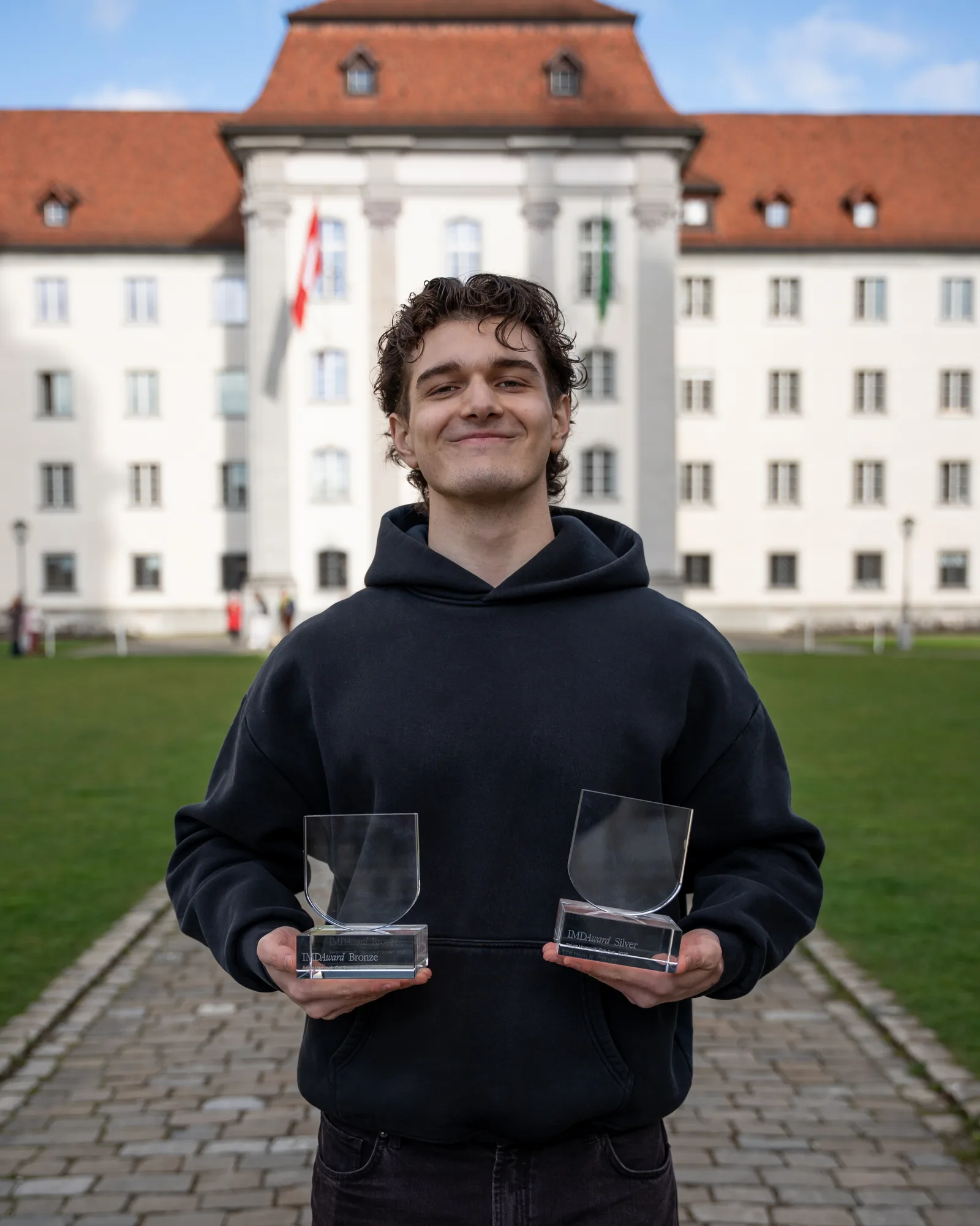 Sevan holding IMD Award trophies